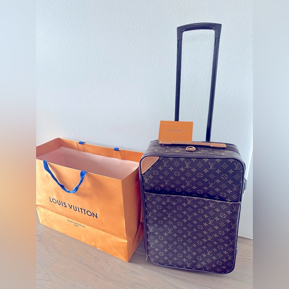 Authentic Louis Vuitton PEGASE 55 Luggage. Wheels and rubber bumpers brand new